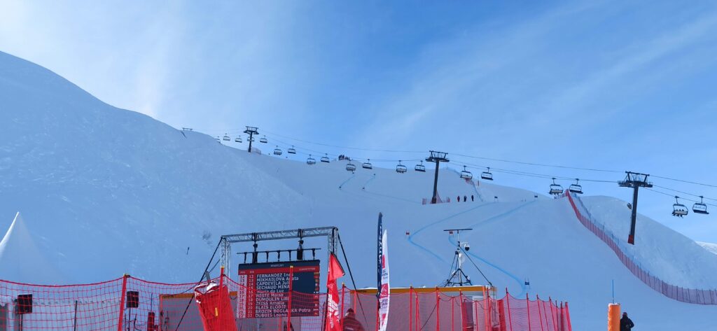 alpine ski race start area with young racers on a competition slope in Austria
